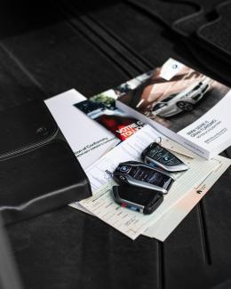 a couple of cell phones on a table by Ivan Kazlouskij courtesy of Unsplash.