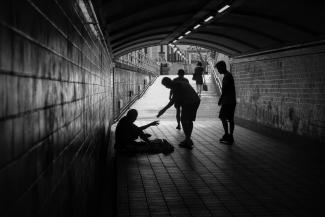 a group of people standing in a tunnel by Elyse Chia courtesy of Unsplash.