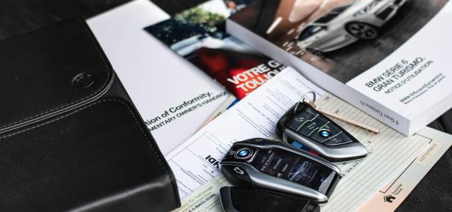 a couple of cell phones on a table by Ivan Kazlouskij courtesy of Unsplash.